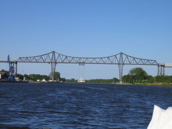 Hanging ferry under the bridge in Rendsburg Hanging ferry under the bridge in Rendsburg