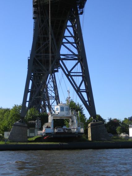 Hanging ferry under the bridge in Rendsburg Hanging ferry under the bridge in Rendsburg
