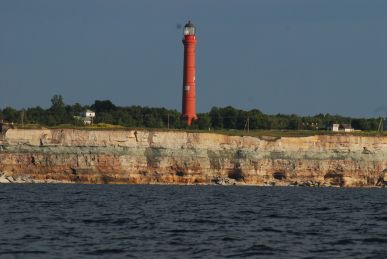 A cape in Estonia with a lighthouse nearly falling off. A cape in Estonia with a lighthouse nearly falling off.